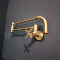 Modern Brass Wall Mount Stove Tap Folded Against Backsplash