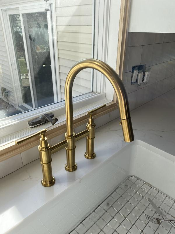 Unlacquered Brass Three Hole Bridge Faucet with Pull-down Spray and Lever Handles